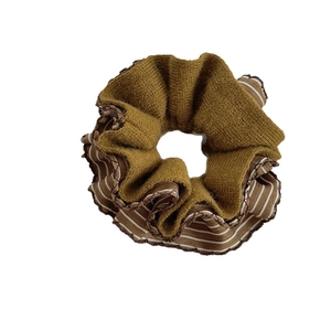 Retro ginger yellow knitted scrunchie with striped edges for autumn hair styling
