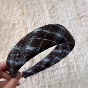 Detail of blue and brown plaid fabric headband with thick padded sponge texture