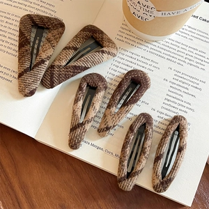 6pcs set of brown plaid fabric hair clips on a vintage book with cozy aesthetic