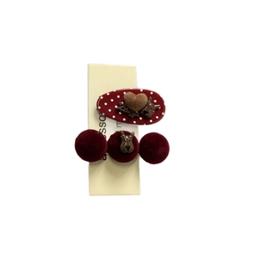 Polka dot bow and velvet pompom hair clips set with metal dog charms on card