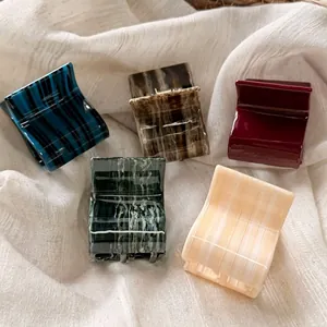 French style square acetate hair claws in various vintage marble patterns and colors