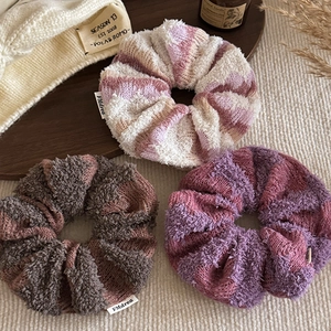 Knitted hair scrunchies set in cozy pink and purple colors for women's autumn hairstyles