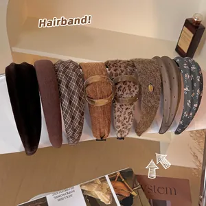 Brown leopard print wide headband collection featuring various fabrics and textures