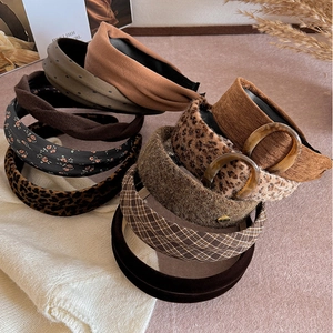 Collection of autumn leopard print and tweed padded headbands in earthy brown tones
