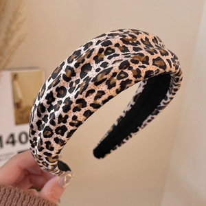Detailed texture of thick leopard print headband with warm brown vintage fabric