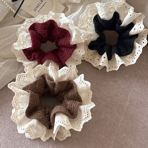 Set of lace-trimmed knitted scrunchies in burgundy, black, and coffee for elegant hair styling