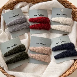 Set of plush faux fur triangle hair clips in six autumn colors on display cards