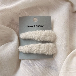 Soft teddy fleece triangular BB hair clips in cream white on display card packaging