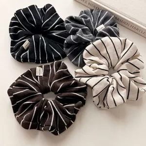 Minimalist knit striped scrunchie set in four neutral colors with handmade labels
