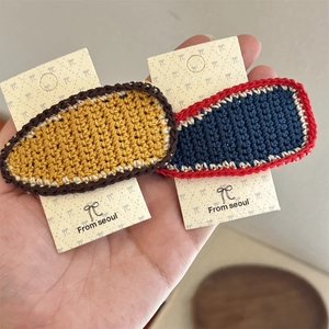 Handmade crochet BB hair clips in vintage contrast colors on decorative display card