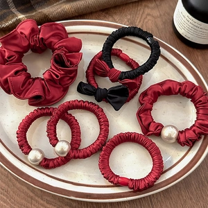 Elegant set of burgundy satin scrunchies and hair ties with pearls and bow details