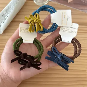 Three-piece set of high-elasticity bow hair ties in blue, green, and brown velvet fabric