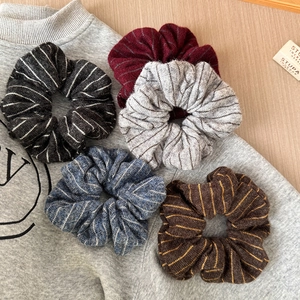 Five-piece set of retro knitted striped scrunchies in various vintage winter colors