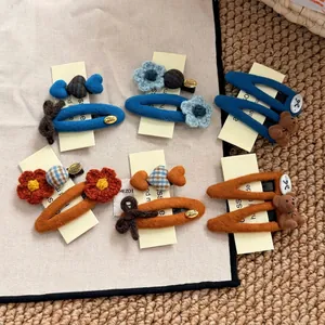 Knitted flower hair clip set for women featuring handmade fabric bear and bow designs