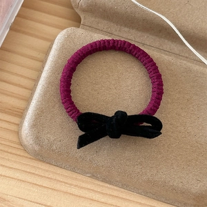 Elegant black velvet bow hair scrunchie in deep purple rib knit elastic band
