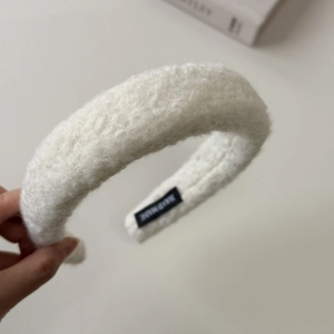 Solid white lamb wool headband for women with handmade label and high-crown design