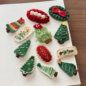 Handmade knitted Christmas hair clips set with festive tree and bow designs
