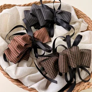 Elegant houndstooth bow hair clip set with long ribbons and premium banana clip design