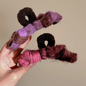 Plush bow hair claw clips for women featuring purple and pink autumn winter textures