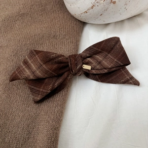 Vintage brown plaid bow hair clip with engraved gold metal tag for elegant women styling