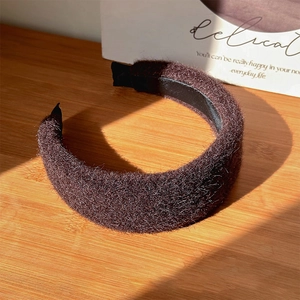Detail showing the brown fuzzy texture and plush fabric of the wide wool headband