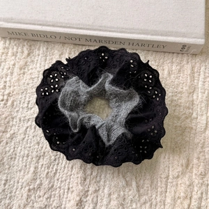 Lace large hair scrunchie with grey plush trim on a soft white knit background