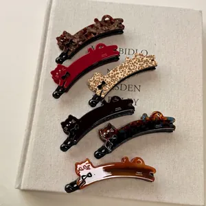 Cute cat-shaped acetate banana hair clips in tortoiseshell and leopard patterns