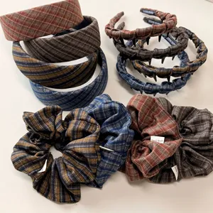 Close-up of vintage fabric headbands and hair ties in autumn plaid and stripe textures