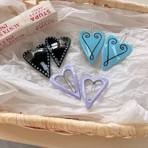 Y2K style heart hair clips set with blue rhinestones and hollow purple design