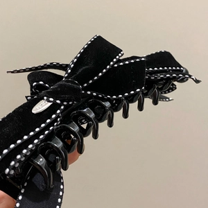 Elegant black velvet bow banana hair clip with contrast stitching and silver accent