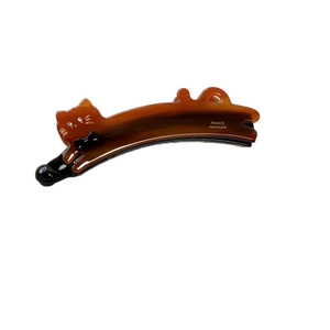 Handmade tortoiseshell acetate cat banana clip with rhinestone eyes and black bow detail