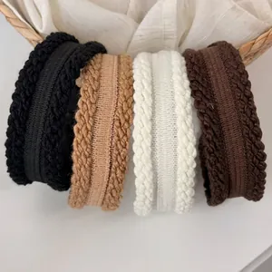 Knitted cable headband set in black, beige, and brown for winter hair styling