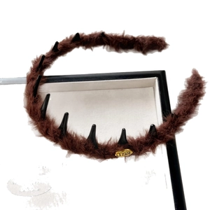 French style brown plush headband with non-slip teeth and a golden oval metal label