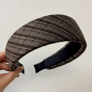 Detail of French striped wide headband showing brown and grey tweed texture