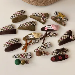 Vintage cat and bow hair clip set in brown earth tones featuring corduroy and plush bear