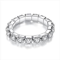 Macro shot of silver eternity ring with square settings and round cubic zirconia stones