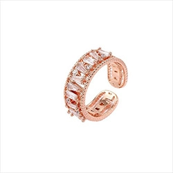 Detail of rose gold open ring featuring a row of baguette-cut zircon stones