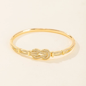 Bracelet jonch à boucle fer à cheval doré avec pavage de zircons brillants pour femme