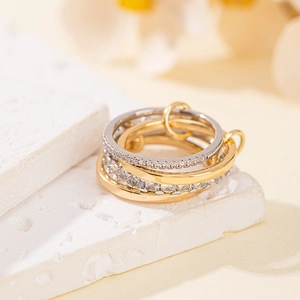 Interlocking luxury zircon rings in gold and silver finish with elegant layered design