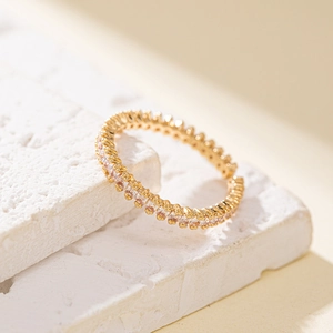 Adjustable gold eternity ring with rectangular baguette cubic zirconia stones