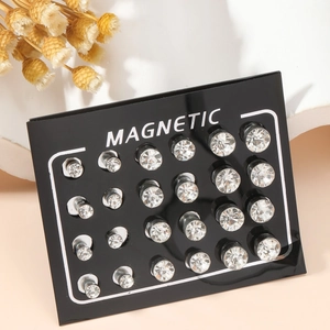 Detailed macro view of 12 pairs of magnetic zircon stud earrings with silver metal base