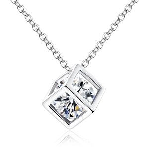 Macro shot of minimalist hollow cube pendant featuring a sparkling clear zircon stone