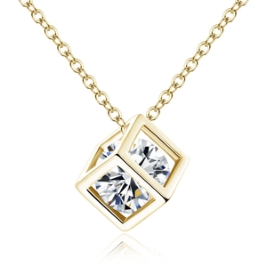 Detailed macro view of the golden cube pendant set with a sparkling round-cut zircon stone