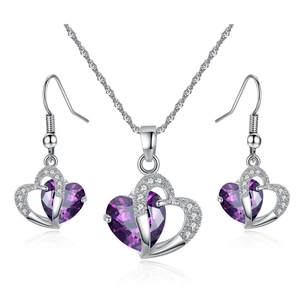 Elegant amethyst heart necklace and earrings set with purple zircon in silver finish