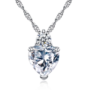Elegant silver heart pendant necklace featuring a large cubic zirconia stone on white background