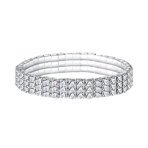 Macro shot of three-row silver elastic rhinestone bracelet with claw-set crystals