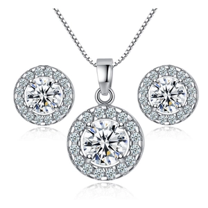 Close-up of sparkling round cut zircon necklace and earrings set in silver finish