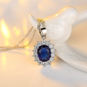 Elegant sunflower pendant necklace featuring blue oval sapphire and white zircon gems