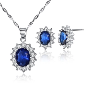 Detail of silver necklace and earrings set featuring oval blue stones with zircon halo