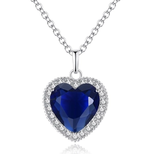 Close-up of heart-shaped blue crystal pendant with pavé cubic zirconia on silver chain